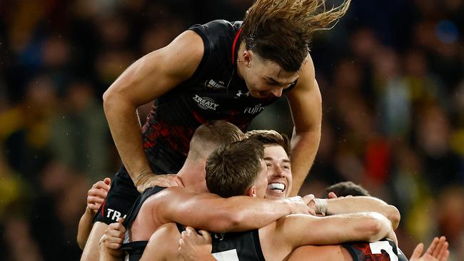 Bombers players celebrate as the final siren sounds. Picture: Getty Images