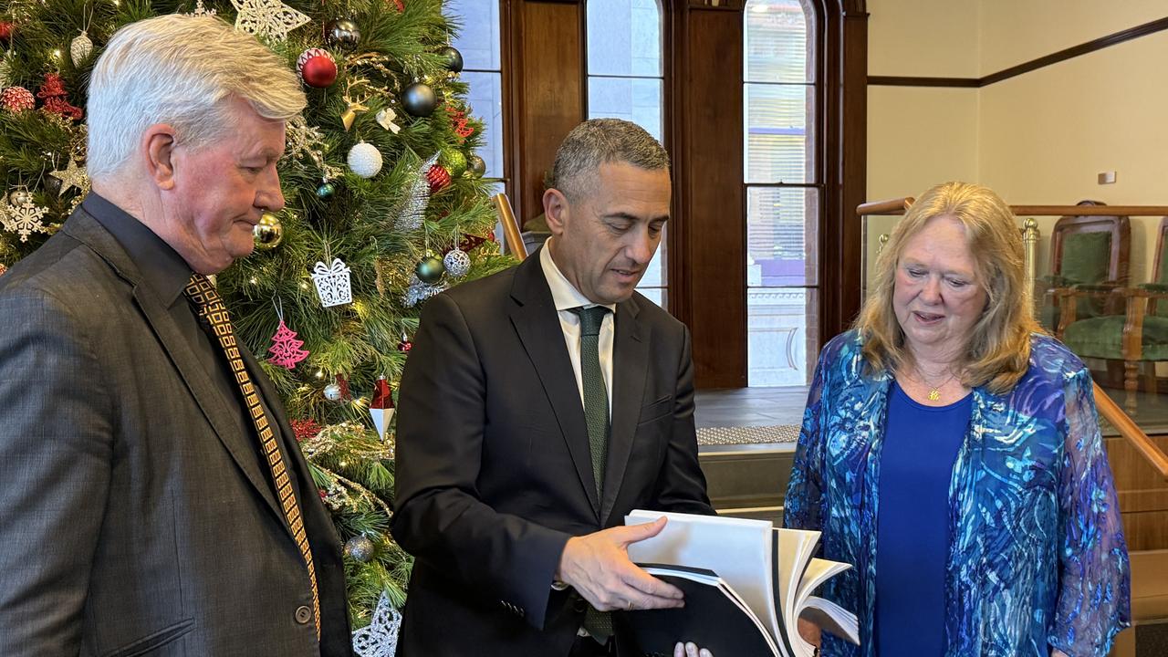 Delphine Mugridge presenting her petition backed by more than 19,000 South Australians to Transport Minister Tom Koutsantonis. Picture: Talara McHugh