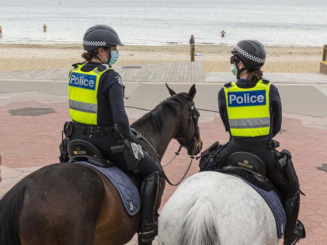 MELBOURNE, AUSTRALIA - NCA NewsWire Photos October 4, 2020:  Police patrols are seen at St Kilda beach in Melbourne, Victoria. Picture: NCA NewsWire / Daniel Pockett