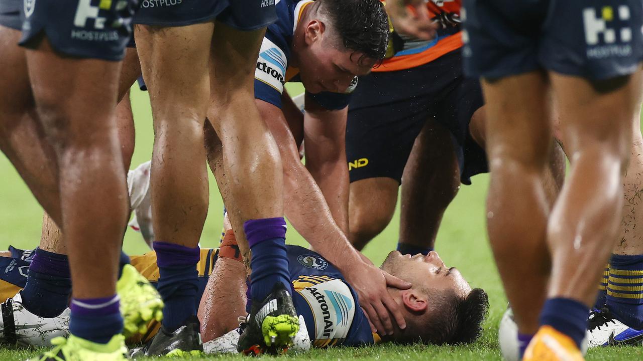 Ryan Matterson of the Eels is attended to by Mitchell Moses of the Eels after a head knock (Photo by Cameron Spencer/Getty Images)