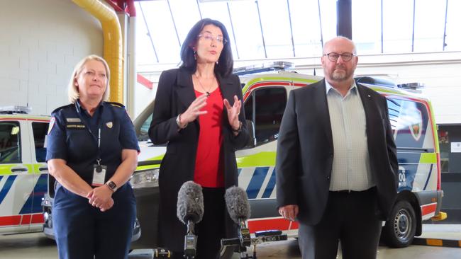 Executive Director of Operations for Ambulance Tasmania Michelle Baxter, Health Minister Jacquie Petrusma and Heath Department secretary Dale Webster speak to the media at Ambulance Tasmania headquarters in Hobart on Monday, December 23, 2024.