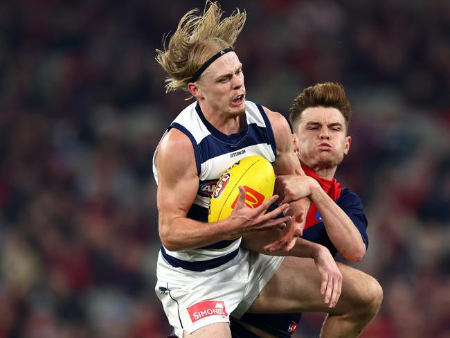 MELBOURNE, AUSTRALIA - MAY 04: Zach Guthrie of the Cats marks infront of Bayley Fritsch of the Demons during the round eight AFL match between Melbourne Demons and Geelong Cats at Melbourne Cricket Ground, on May 04, 2024, in Melbourne, Australia. (Photo by Quinn Rooney/Getty Images)