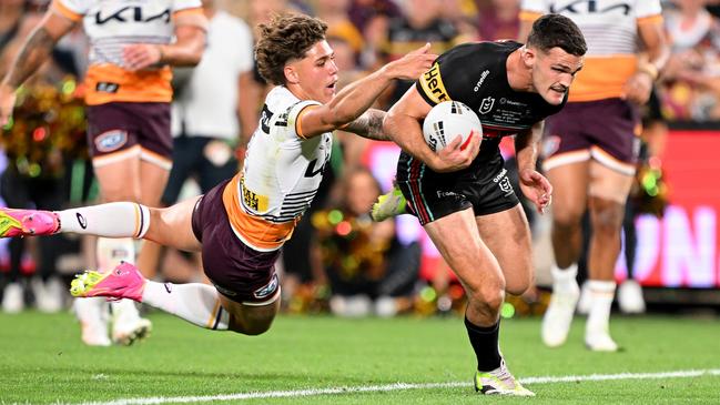 Nathan Cleary gets past Reece Walsh to score the winning try for the Broncos. Picture: Getty Images