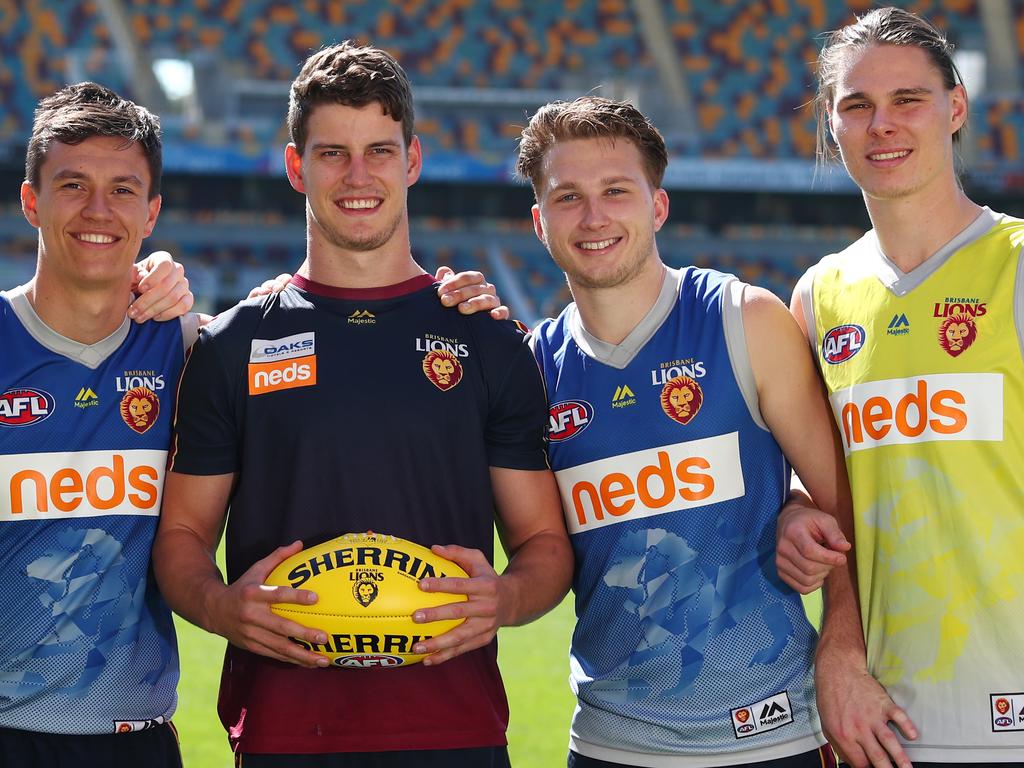 BRISBANE, AUSTRALIA - AUGUST 06: Harris Andrews, Hugh McCluggage, Jarrod Berry, Alex Witherden and Eric Hipwood pose during a Brisbane Lions AFL training session at The Gabba on August 06, 2019 in Brisbane, Australia. (Photo by Chris Hyde/Getty Images)