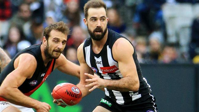 Steele Sidebottom on the break away from Jobe Watson. Picture: Mark Stewart