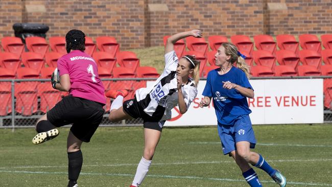 SAVE: Rockville goalkeeper Amy McDonnell, saves a Hayley Gray shot during last year’s TFL Premier Women’s division grand final. Can Rockville defend their title in 2020?.