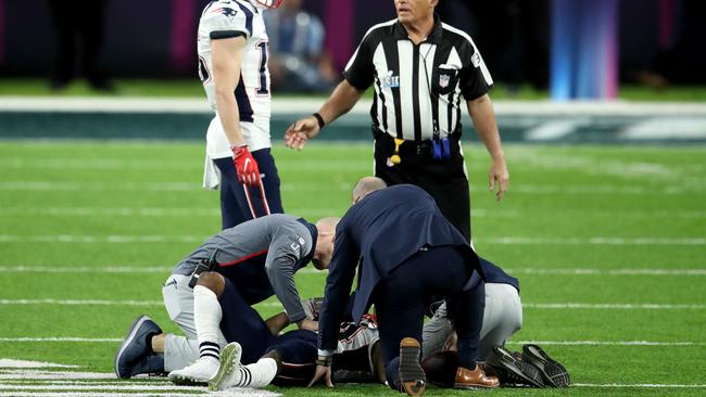 Trainers look over Brandin Cooks. Picture: Getty Images.