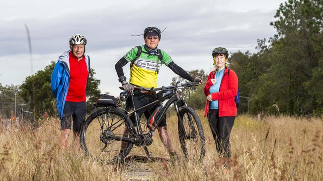 Logan Village cyclists Paul Casbolt, middle, with John and Julie Shera on the rail trail land at Logan Village. PHOTO: Richard Walker