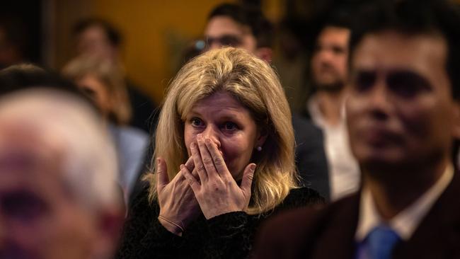 A woman appears to be holding back tears at the Liberal party election night. Picture: Jason Edwards