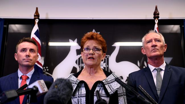 Queensland Senator and One Nation leader Pauline Hanson flanked by party officials James Ashby and Steve Dickson. Picture: AAP/Dan Peled