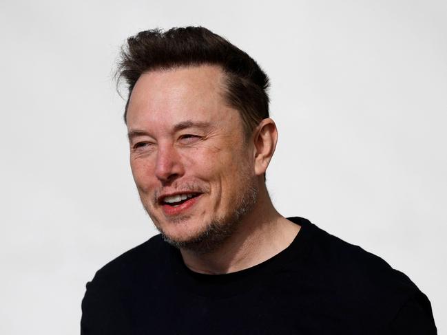 (FILES) Tesla CEO Elon Musk is pictured during a visit at the company's electric car plant in Gruenheide near Berlin, eastern Germany, on March 13, 2024, as employees resumed work after production had to be halted due to a suspected arson attack that caused a power outage. Tech billionaire Elon Musk is set to visit India as his businesses seek new markets in the world's most populous nation, with electric carmaker Tesla -- suffering a sales downturn in the United States -- reportedly scouting factory locations. (Photo by Odd ANDERSEN / AFP)