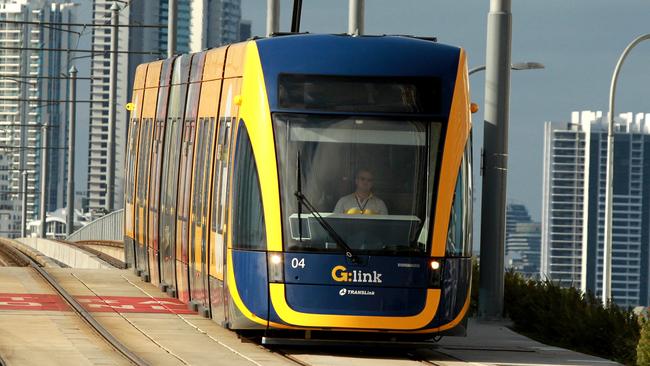 Gold Coast tram on the Southport Bridge . (sorry cloudy morning no sun ) . Picture Mike Batterham