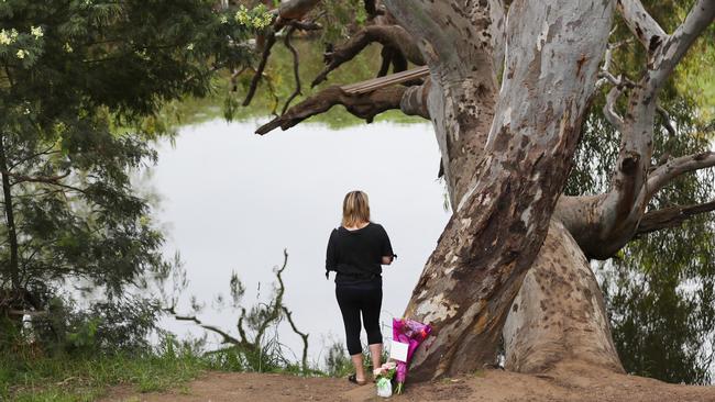 Locals have placed flowers at the scene of the tragedy. Picture: David Crosling