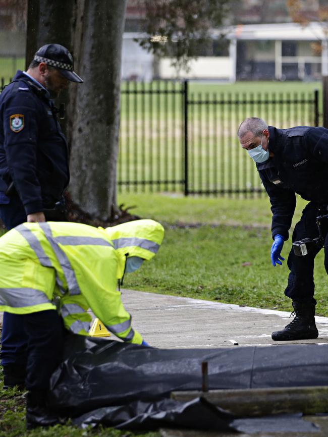 Police investigate the scene at Old Saleyards Reserve. Picture: Adam Yip