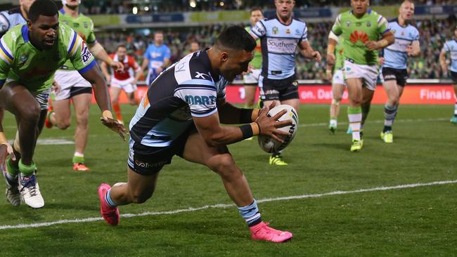 Valentine Holmes of the Sharks scores a try.