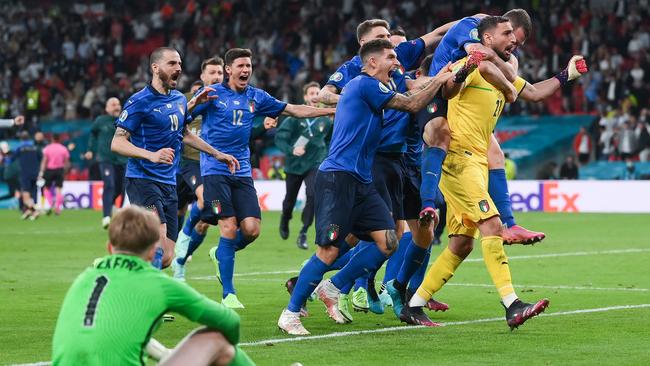 Gianluigi Donnarumma of Italy celebrates with teammates after saving the England fifth penalty taken by Bukayo Saka. Picture: Getty Images