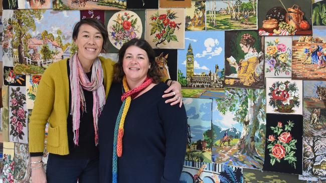 Building ties: Sasha Barrow with fellow Embassy of Ideas committee member Kerry McGahy in front of the feature wall in the embassy.