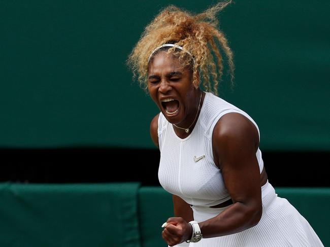 TOPSHOT - US player Serena Williams celebrates winning a point against US player Alison Riske during their women's singles quarter-final match on day eight of the 2019 Wimbledon Championships at The All England Lawn Tennis Club in Wimbledon, southwest London, on July 9, 2019. (Photo by Adrian DENNIS / AFP) / RESTRICTED TO EDITORIAL USE