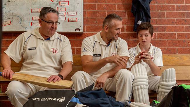 Romanian cricketer Pavel Florin with club president Mal Campbell and young teammate Ben Andrew. Picture: Mark Dadswell