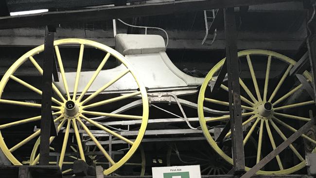 An old carriage is on display at the business.