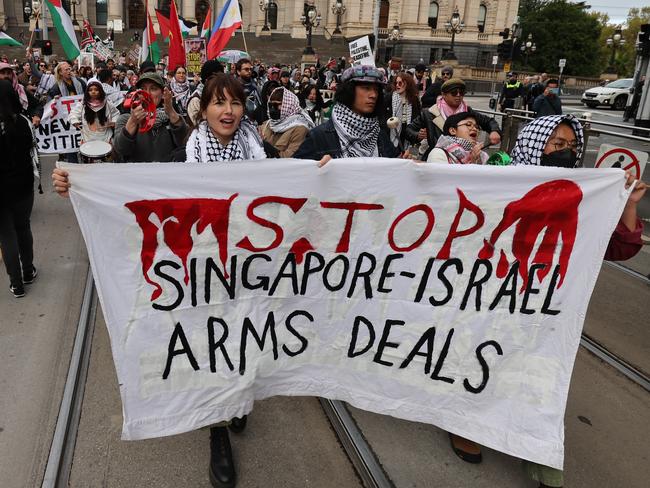 Palestine protester on ANZAC Day. Protesters leave Parliament House down Bourke Street.                     Picture: David Caird