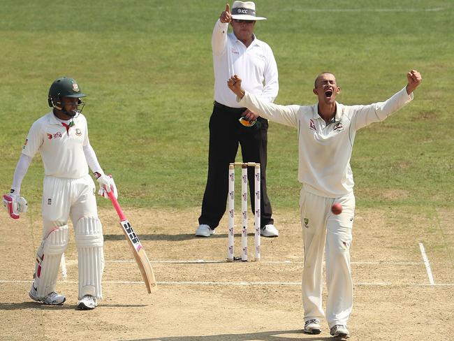 Ashton Agar of Australia celebrates after taking a wicket during the Test match between Bangladesh and Australia in September 4.