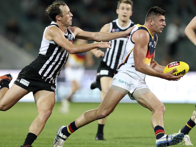 Adelaide’s Patrick Wilson was tagged by Magpies’ Cam Sutcliffe during the Crows SANFL qualifying final loss at Adelaide Oval on Saturday night. Picture: SARAH REED