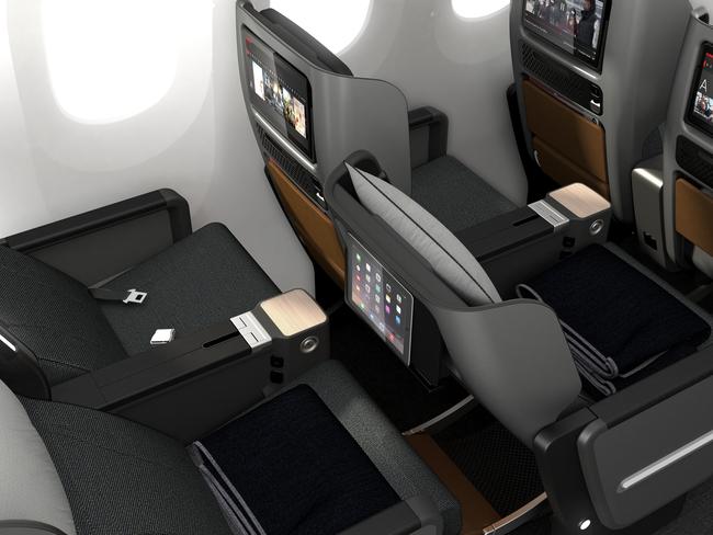 There are five personal compartments within easy reach, a larger tray table and a new “cocktail table”, plus a holder for your BYO screens. Picture: Qantas