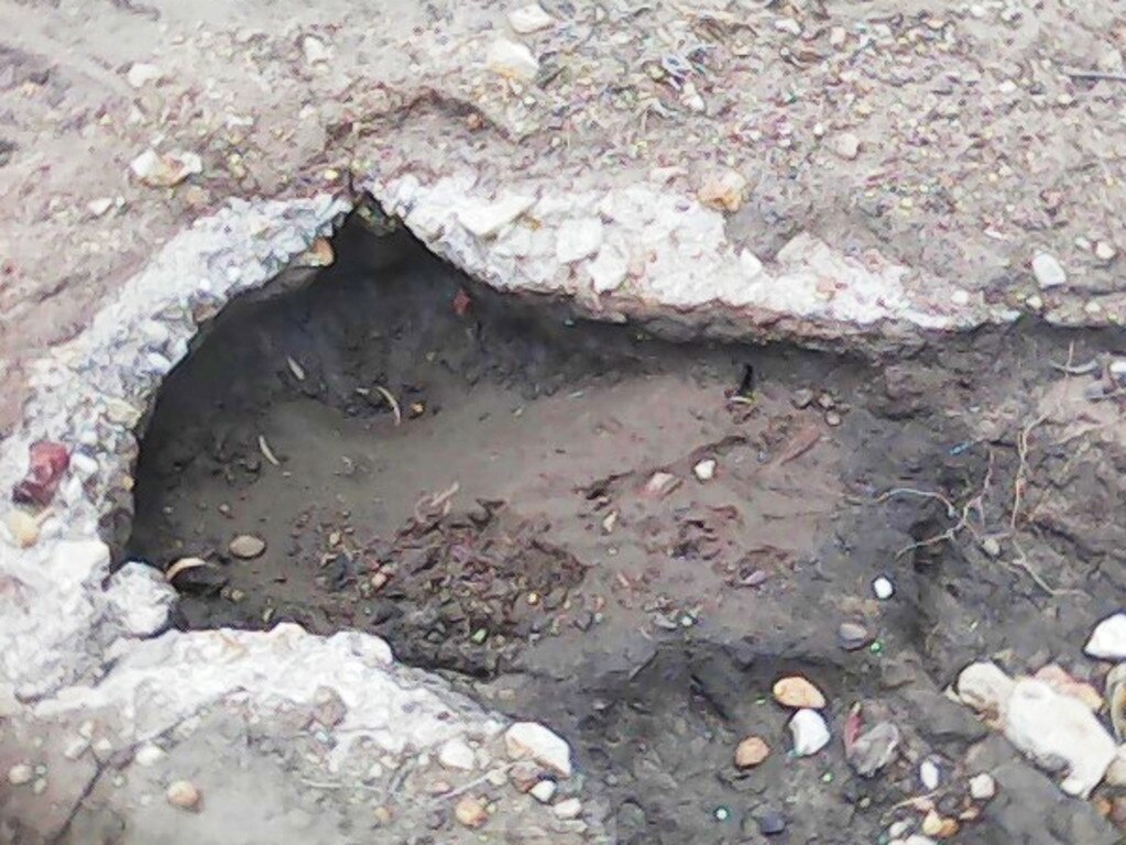 A photo of a washed out hole along Gazzards Road from earlier this year. Mr Parry says the unsealed roads around Tara are dotted with washouts like this after just a few millimetres of rain. Picture: Contributed