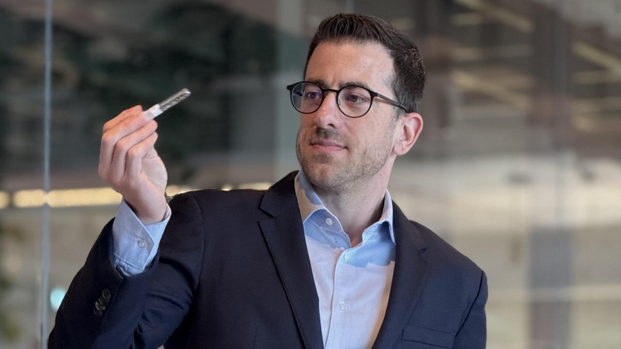 Tessara Therapeutics chief executive Dr Christos Papadimitriou with one of his company's ‘mini brains’ in a test tube. Picture: Supplied