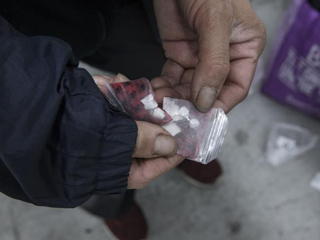 A heroin user in a Melbourne CBD carpark stairwell. Picture: Ian Currie