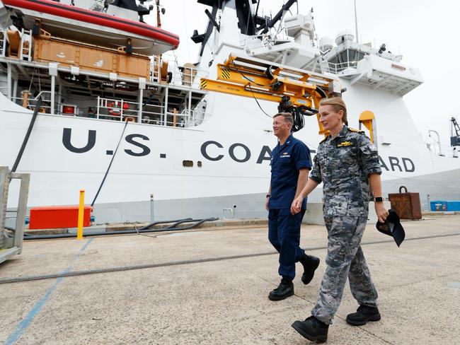 25-02-2025 - U.S. Coast Guard Cutter Midgett docked at HMAS Kuttabul Navy base in Sydney as part of a deployment to support maritime security and a free and open Indo-Pacific. Captain of the Cutter Midgett Matthew Rooney and HMAS Kuttabul commanding oficer Rebecca Levitt talk before touring the ship with media. Picture: Max Mason-Hubers / The Australian