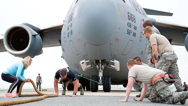 Grant Edwards pulls a C-17 Globemaster III aircraft in 2017. Picture: Alamy