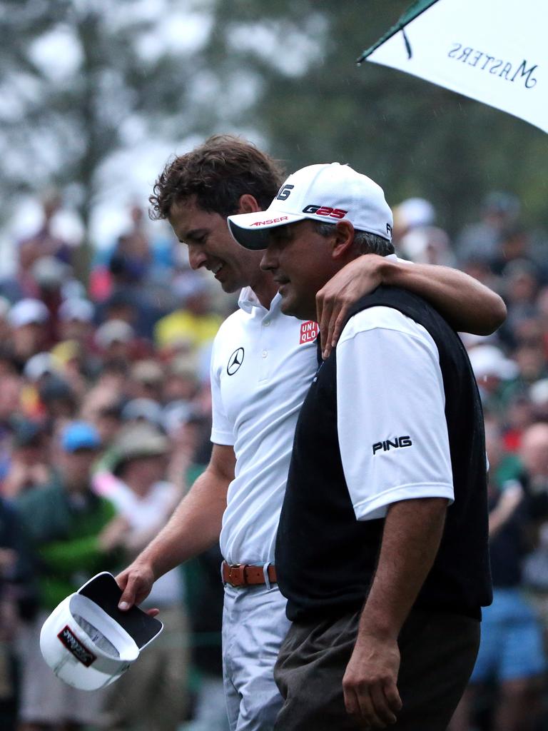 Adam Scott of Australia and Angel Cabrera of Argentina after the second play off hole which saw Scott win the Green Jacket.