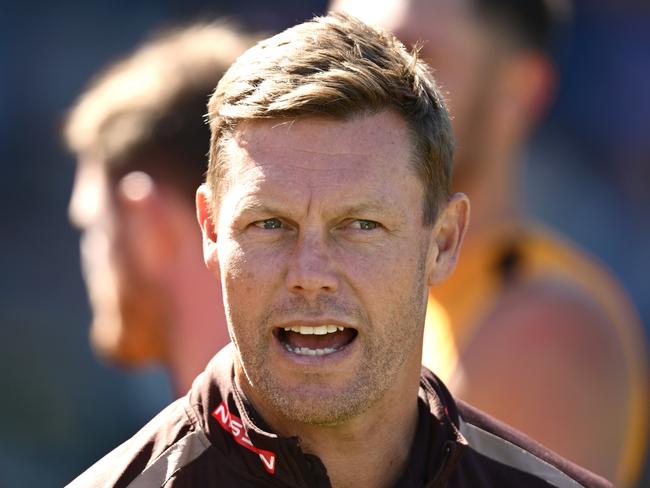 GEELONG, AUSTRALIA - FEBRUARY 17: Sam Mitchell the coach of the Hawks talks to his players during the AFL practice match between Geelong Cats and Hawthorn Hawks at GMHBA Stadium on February 17, 2025 in Geelong, Australia. (Photo by Quinn Rooney/Getty Images)