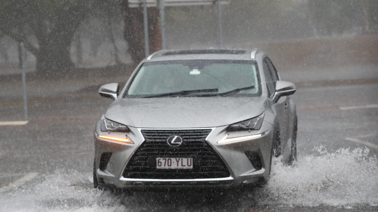 Motorists on Queen St in Southport after a storm lashes the Gold Coast. Photograph : Jason O’Brien