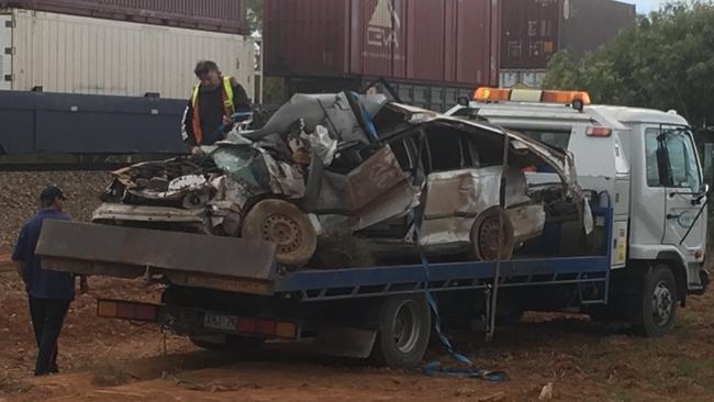 The wreckage of the car after it crashed into a train. Picture: Mitch Mott