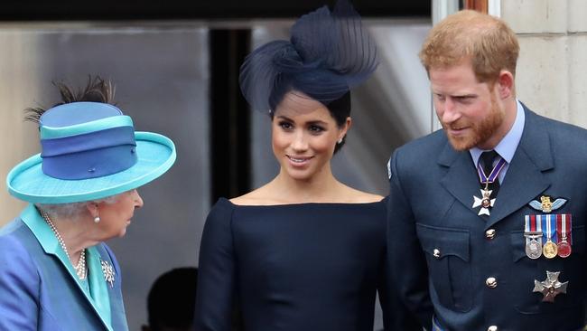 Meghan and Harry, right, with the Queen prior to their Megxit split. Picture: Getty Images