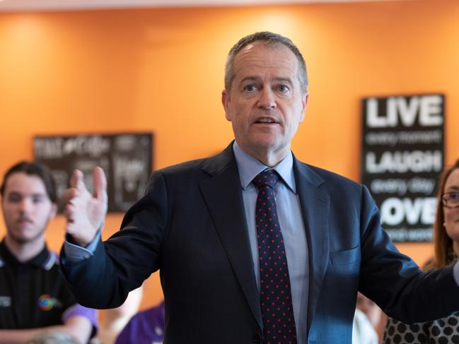 Opposition Leader Bill Shorten (centre) is seen visiting the Meercroft Aged Care Home with the Labor candidate for Braddon Justine Keay (right) in Devonport, Tasmania, Tuesday, July 10, 2018. (AAP Image/Grant Wells) NO ARCHIVING