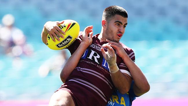 Manly's Tom Wright is tackled in the 2017 Holden Cup U20's Grand Final.