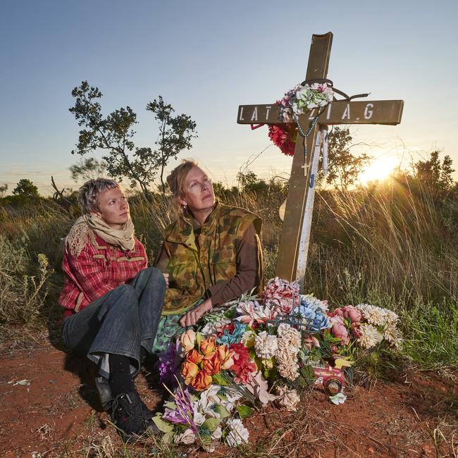 Amanda Ducker (right) with her daughter Zia Sikora, 26, visit Tenny’s roadside memorial. Picture: Joe Shemesh