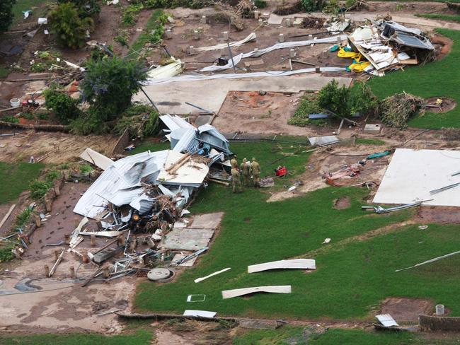 Cars, parts of homes and flood damage in the town of Grantham, west of Brisbane, one of areas affected in flood-ravaged Queensland.