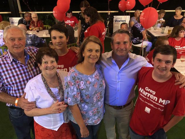 Greg Warren celebrates with his family.