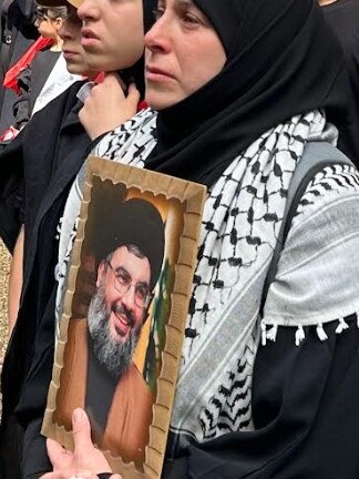 Protesters outside Sydney Town Hall today are holding pictures including slain Hezbollah leader Hassan Nasrallah. Picture: Supplied.