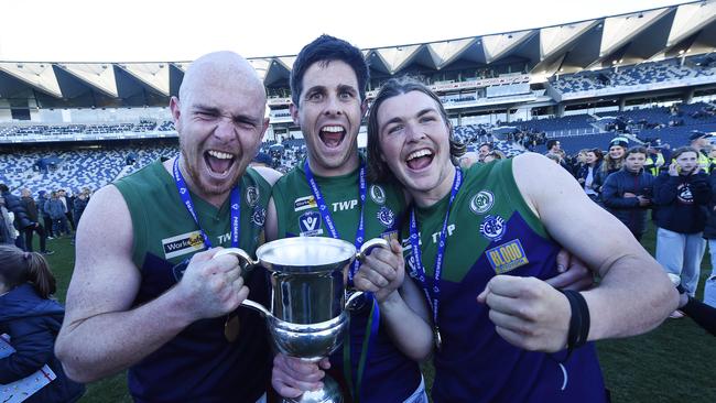 St Mary's players Ryley Hall (14), Damian McMahon (16) and Harry Benson (9) celebrate their 2019 grand final win. Picture: Alan Barber