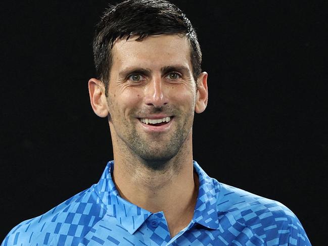 Serbia's Novak Djokovic reacts on a point against Spain's Roberto Carballes Baena during their men's singles match on day two of the Australian Open tennis tournament in Melbourne on January 17, 2023. (Photo by Martin KEEP / AFP) / -- IMAGE RESTRICTED TO EDITORIAL USE - STRICTLY NO COMMERCIAL USE --