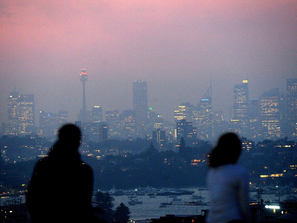 Sydney’s skyline is blanketed by smoke on Monday night. Picture: Jeremy Piper