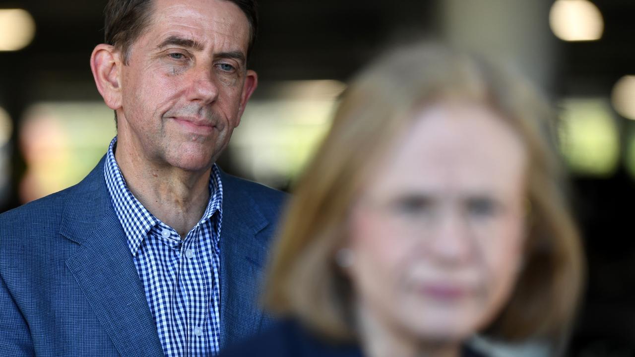 Queensland Treasurer Cameron Dick watches Chief Health officer Dr Jeannette Young during a media conference at a Bunnings in Logan. Picture: Dan Peled/Getty Images