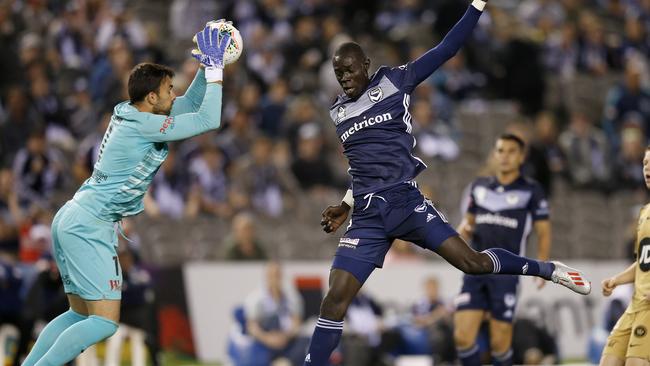 Wanderers goalkeeper Daniel Lopar makes a save in front of Kenny Athiu.