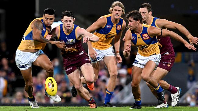 Tim Kelly and Lachie Neale go head-to-head. Picture: Bradley Kanaris/Getty Images